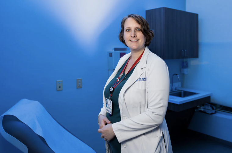 photo of doctor in examine room, blue tint