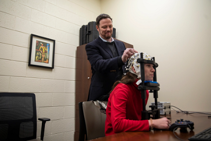 Greg Strauss working with patient 