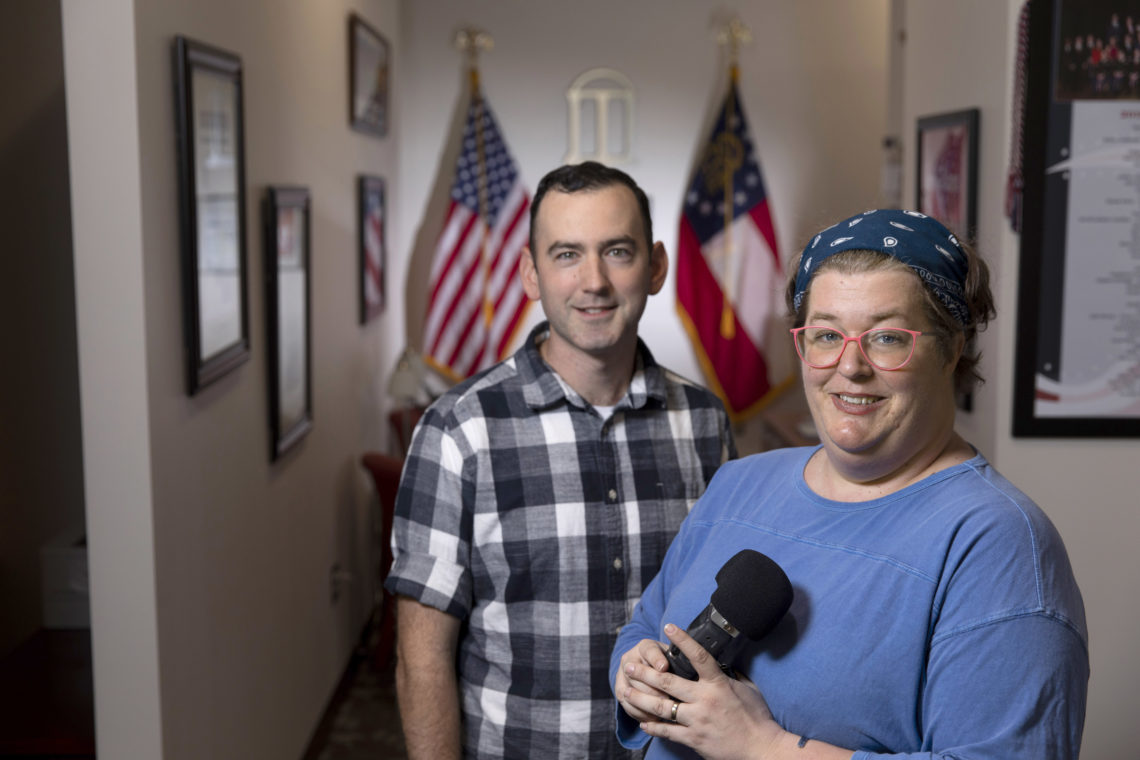 image of man and woman, woman holding a microphone