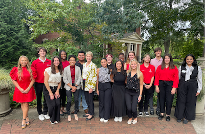 Students with Dean Anna Stenport outside