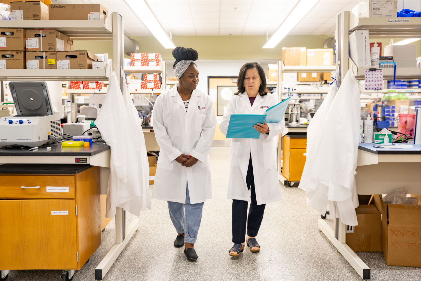 A student and faculty member inside of a UGA research lab