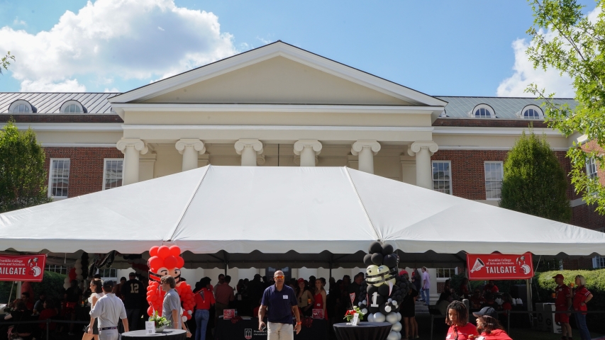wide shot photo of event tent with people