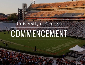 photo of stadium at twilight, with white letters