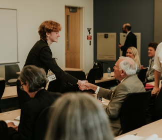 photo off woman sharing hands with man