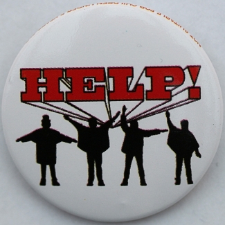 photo of button with the HELP! and four figures