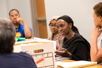 photo of people with file box in discussion