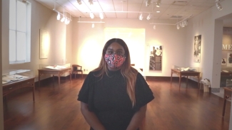 photo of woman with tables and light in background 