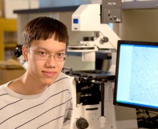 student with computer