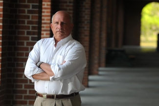 photo of man, corridor in background, day
