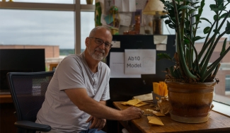 photo of man at desk with corn kernels