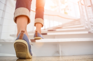 photo of shoes and legs on stairs