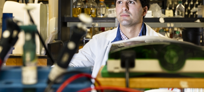 photo of man, with lab instruments in foreground