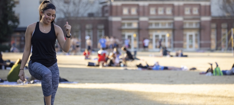 photo of student quad, with woman in foreground