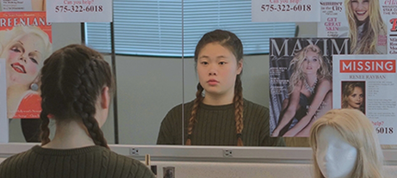 promo photo with girl sitting before mirror
