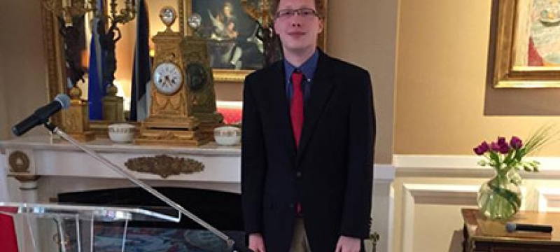 student in ornate room
