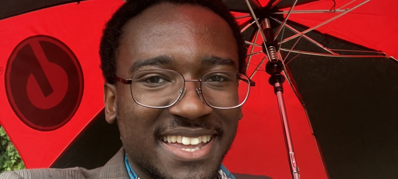 photo of man holding umbrella