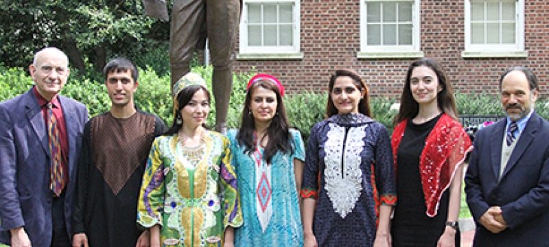 people outside with statue