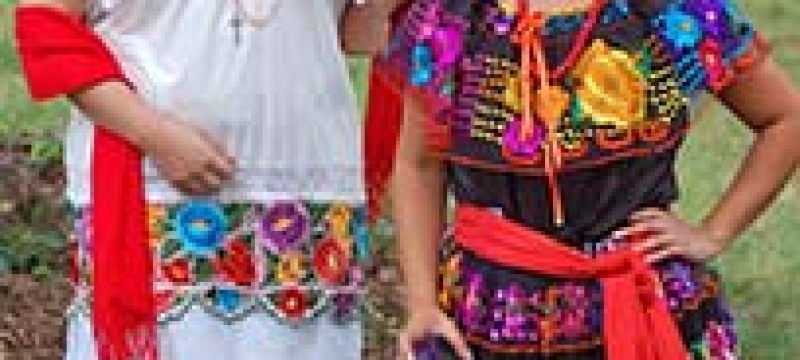 dancers in traditional Aztec costume