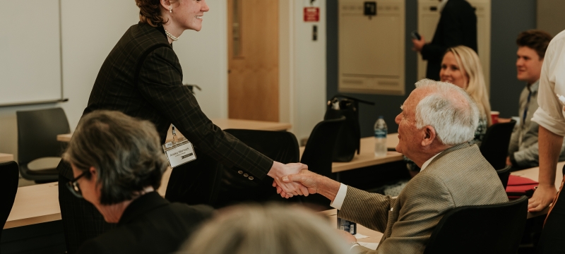 photo off woman sharing hands with man