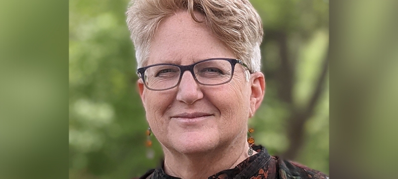 photo of woman, with glasses, outdoors
