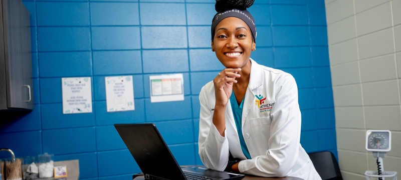 photo of woman with laptop in exam room