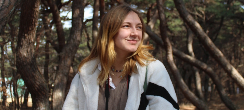 photo of woman, trees in background