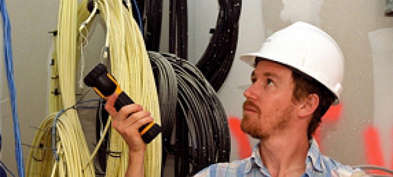 man in hard hat, with flashlight