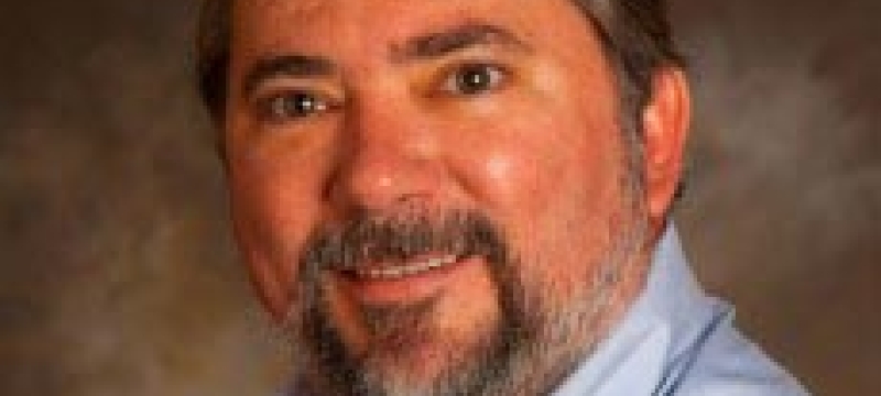 Larry Young in a blue shirt.