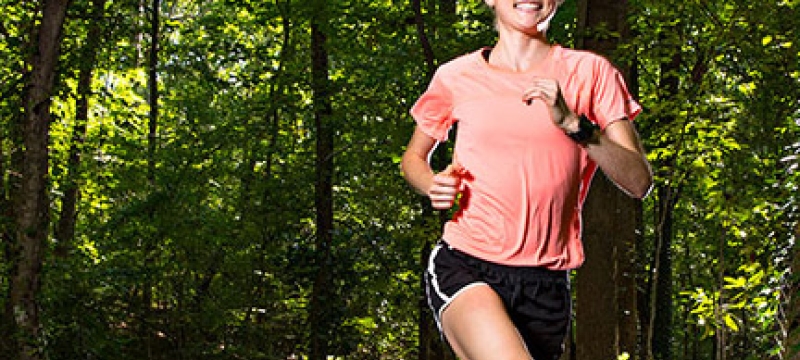 woman running in the woods