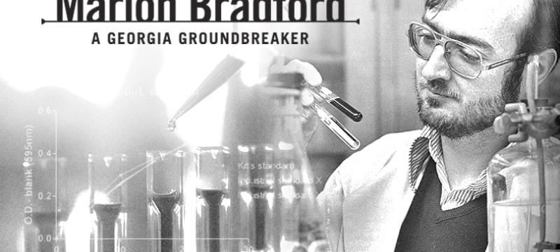 black and white photo of man and test tubes with graphic