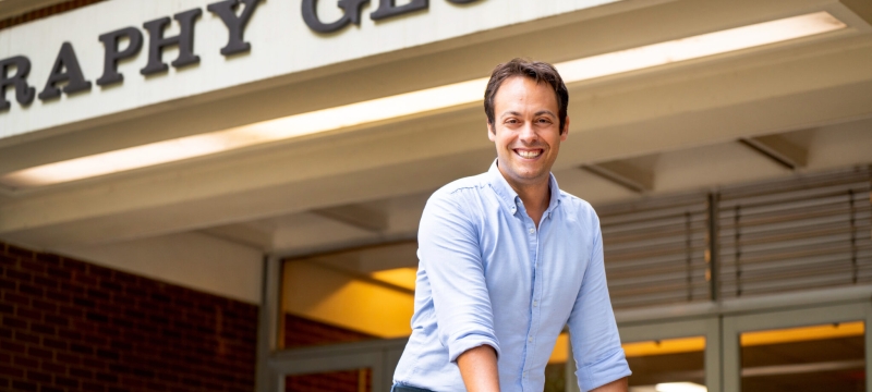 photo of man at building entrance