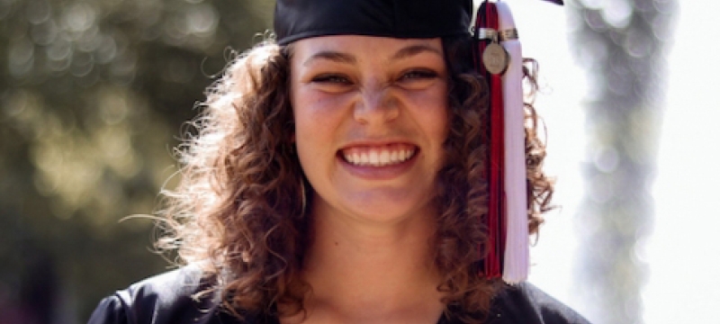 photo of woman in cap and gown