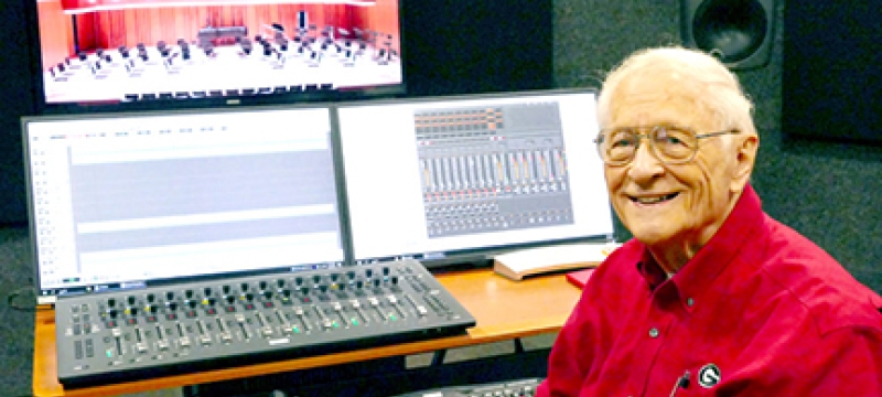 photo of man at recording board