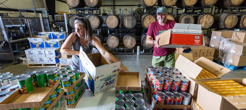 photo of two people at food pantry warehouse