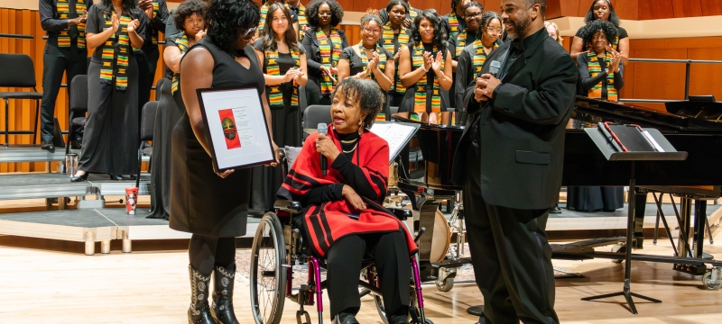 group photo of ensemble, three people in foreground