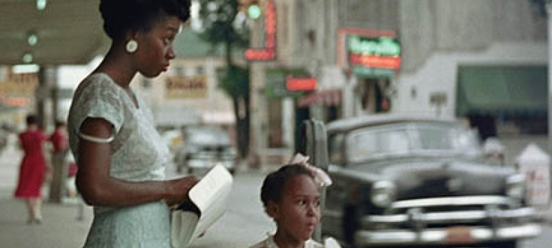 woman with girl near street