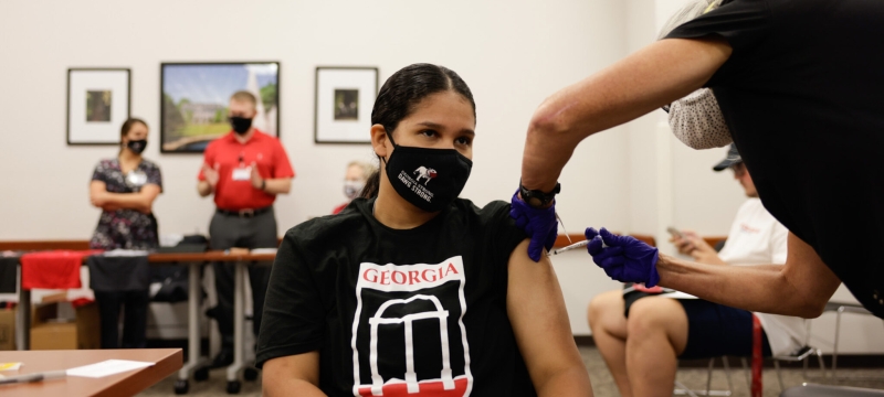 photo of woman getting vaccinated