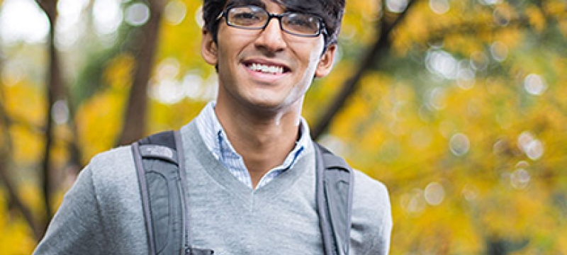 man outside with backpack