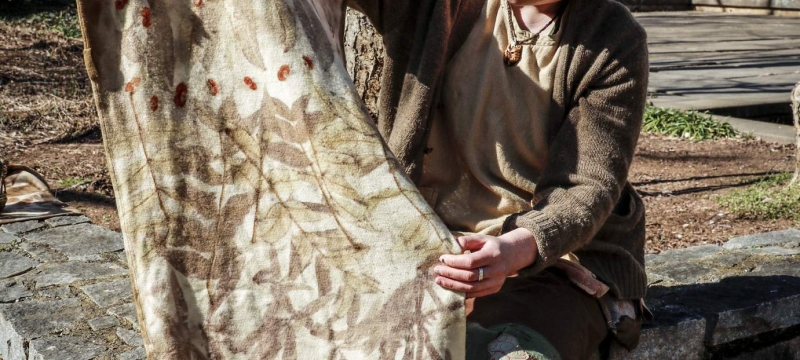 pho too woman holding eco-print fabric, outside, day