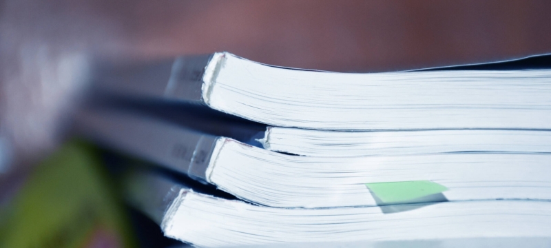 photo of small stack of bound manuscripts