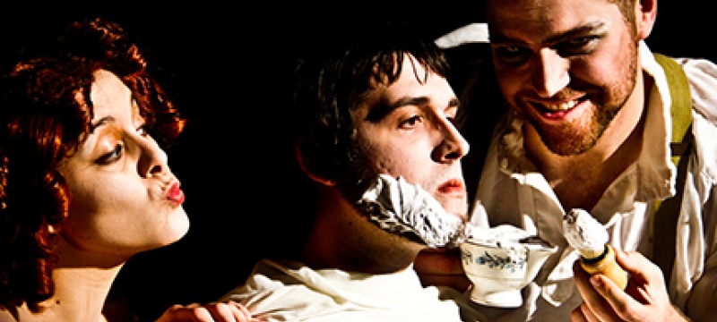 woman with man shaving another