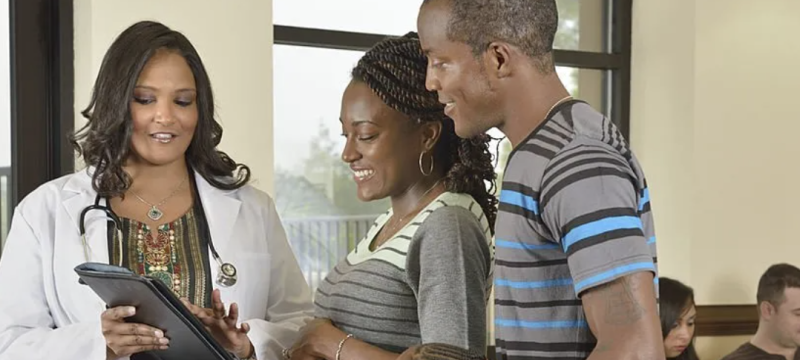 photo of family with physician in discussion
