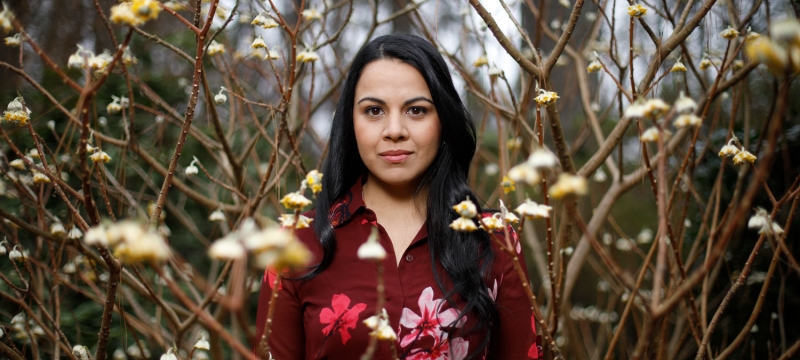 photo of woman with flower buds
