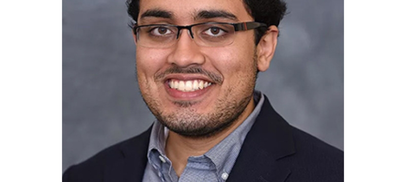 headshot of man with glasses