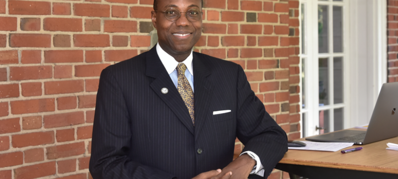 photo of man at standing desk, outdoors