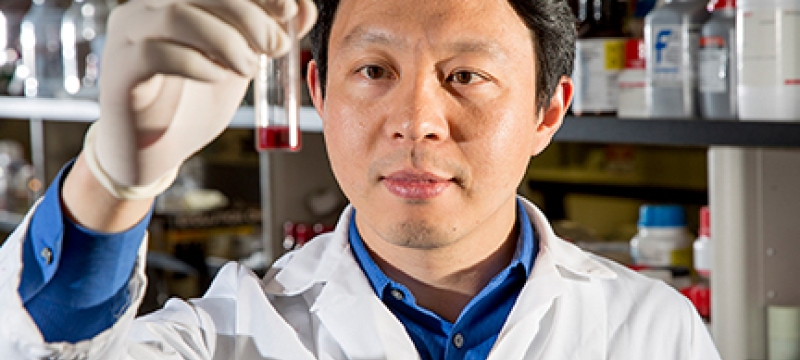 man in lab with test tube