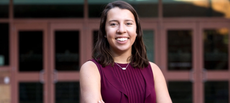photo of woman outdoors, with building