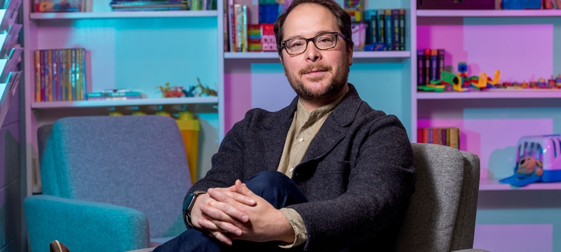 photo of man seated in office