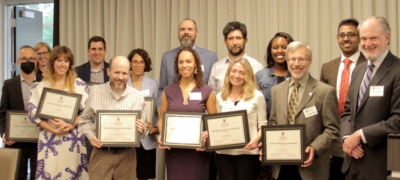 group photo of people holding plaques