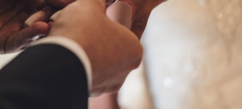 photo of hands with ring